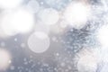 Abstract blurred festive winter christmas or Happy New Year background with shiny blue and white bokeh lighted snow landscape. Royalty Free Stock Photo