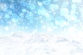 Abstract blurred festive winter christmas or Happy New Year background with shiny blue and white bokeh lighted snow landscape with Royalty Free Stock Photo