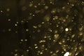 Abstract blurred gold bokeh lights background. Defocused glitter light Royalty Free Stock Photo