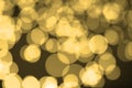 Abstract blurred gold bokeh lights background. Defocused glitter light Royalty Free Stock Photo