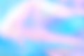 Abstract blurred holographic foil background in light colors