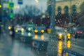 Abstract blurred illuminated city street, traffic, rainy night, transportation, illumination, reflection on wet asphalt Royalty Free Stock Photo