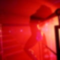 Abstract blurred image of dancing woman in night club as a background Royalty Free Stock Photo