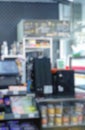 Abstract Blurred image in front of minimarket counter