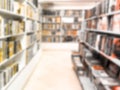 Abstract blurred modern white bookshelves with books. Blur manuals and textbooks on bookshelves in library or in book store. Royalty Free Stock Photo