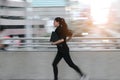 Abstract blurred motion of young Asian business woma running to work