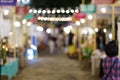 Abstract blurred night market view of empty supermarket aisle, defocused blurry background with bokeh light . street food market Royalty Free Stock Photo