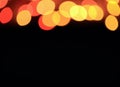 Abstract Blurred of Orange and Red Illuminated Decorating Light on Dark Background