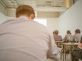 Abstract blurred photo of conference hall or seminar room with attendee background Royalty Free Stock Photo