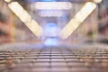 Abstract blurred photo of empty trolley in supermarket bokeh background. Empty shopping cart in supermarket Royalty Free Stock Photo