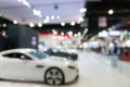 Abstract blurred photo of motor show, car show room