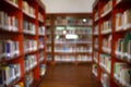 Abstract blurred public library interior space. blurry room with bookshelves Royalty Free Stock Photo