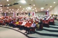 Abstract blurred put spaces between attendee in conference hall for social distancing to prevent the spread of Covid-19 Royalty Free Stock Photo