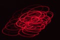 Abstract blurred red light effect on a black background. Long exposure photo of moving camera