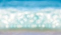 Abstract blurred shining sunlight bokeh on blue sea horizontal background Royalty Free Stock Photo