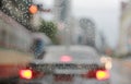 Abstract blurred traffic in raining day with road view through car Royalty Free Stock Photo