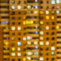 Abstract blurred windows close-up with light bokeh at night, defocused background. Concept of nightlife with family