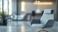 Abstract Blurry Office Background with Grey Armchair and Minimalist Design in a Professional Setting Royalty Free Stock Photo