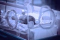 Abstract, blurry, out of focus image for media and internetÃÂ°. Sleeping newborn baby in the hospital post-delivery room. Royalty Free Stock Photo