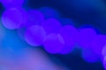 Abstract blurry purple blue bokeh light circles glowing in the nightl background