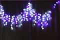 Abstract bokeh background. Blurred garland lights Royalty Free Stock Photo