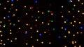 Abstract bokeh background in motion. shining, blurred multicolored particles, lights. bright bokeh from garlands on dark Royalty Free Stock Photo