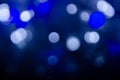 Abstract bokeh of blue and white lights on a dark background Royalty Free Stock Photo