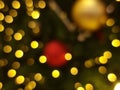 abstract bokeh blur light circle red orange and yellow christmas tree glowing flare pattern black background Royalty Free Stock Photo