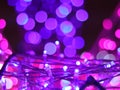 Abstract Bokeh light blurred background, lightbulb on Christmas tree for celebrate season with pink, purple and white colorful def Royalty Free Stock Photo