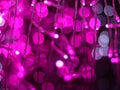 Abstract Bokeh light blurred background, lightbulb on Christmas tree for celebrate season with pink, purple and white colorful def Royalty Free Stock Photo