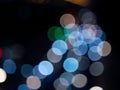 Abstract bokeh night light background, blurred lights traces from cars on road, defocused city traffic on street at night Royalty Free Stock Photo