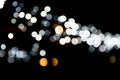 Abstract bokeh of white city lights on black background. defocused and blurred many round light Royalty Free Stock Photo