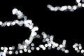 Abstract bokeh of white city lights on black background. defocused and blurred many round light Royalty Free Stock Photo