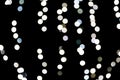 Abstract bokeh of white city lights on black background. defocused and blurred many round light Royalty Free Stock Photo