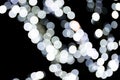 Abstract bokeh of white city lights on black background. defocused and blurred many round light Royalty Free Stock Photo