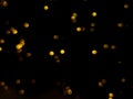 abstract bokeh yellow light orange and white glowing flare pattern black background Royalty Free Stock Photo