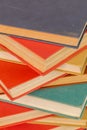 abstract books background - old red and muted green ones in a vertical stack