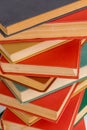 abstract books background - old red and muted green ones in a vertical stack