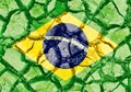 Grunge Brazil flag isolated on dry cracked ground background Royalty Free Stock Photo