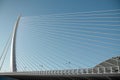 Abstract bridge, white lines in the blue sky, abstract sculpture