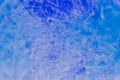 Abstract bright blue background made of transparent slime with air bubbles Royalty Free Stock Photo