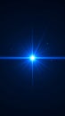 Abstract bright blue light burst with star shape and glowing rays on dark background Royalty Free Stock Photo