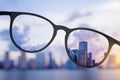 Abstract bright city view through eyeglasses Royalty Free Stock Photo