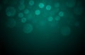 Abstract bright dark green bokeh flickering out of focus. Winter card or invitation