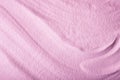 Abstract bright pink sand texture with smooth waves. Fashion background.