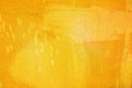 The abstract bright yellow surface has a brush painted on the background for graphic design.