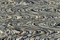 Abstract bright zigzag pattern with waves. Artistic image processing created by photo of sea stones. Calm multicolor pattern