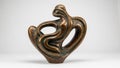 Abstract bronze sculpture featuring fluid, intertwining curves and organic Royalty Free Stock Photo