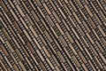 Abstract brown background of woven wooden napkin.