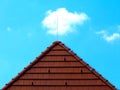 Abstract brown clay tile roof detail with blue sky and white cloud Royalty Free Stock Photo